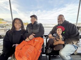 Passengers Jack Patton, Jessenia Diaz, Micol McNair, Jr., and Micol McNair, Sr. enjoy a ride on the ferry.