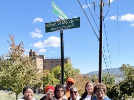 Mr. Moody's family pose for a photo after the dedication of Robert W. Moody Way.
