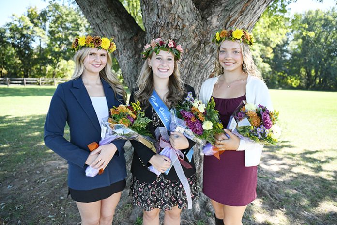 2026 Mum Queen Kathryn Hopf (center) poses with Court members Sage Sasso (left) and Lauren Stinemire prior to the start of the annual Mum Bowl football game. Photo: Kristine Conte